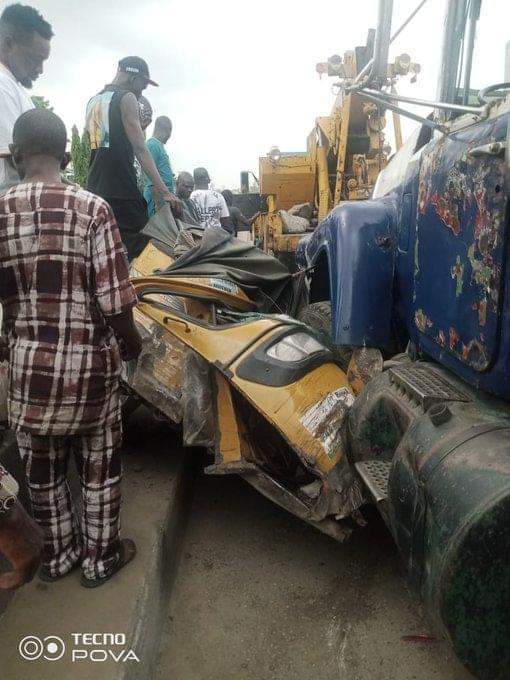PHOTOS: Truck crushes keke, damages car in Lagos